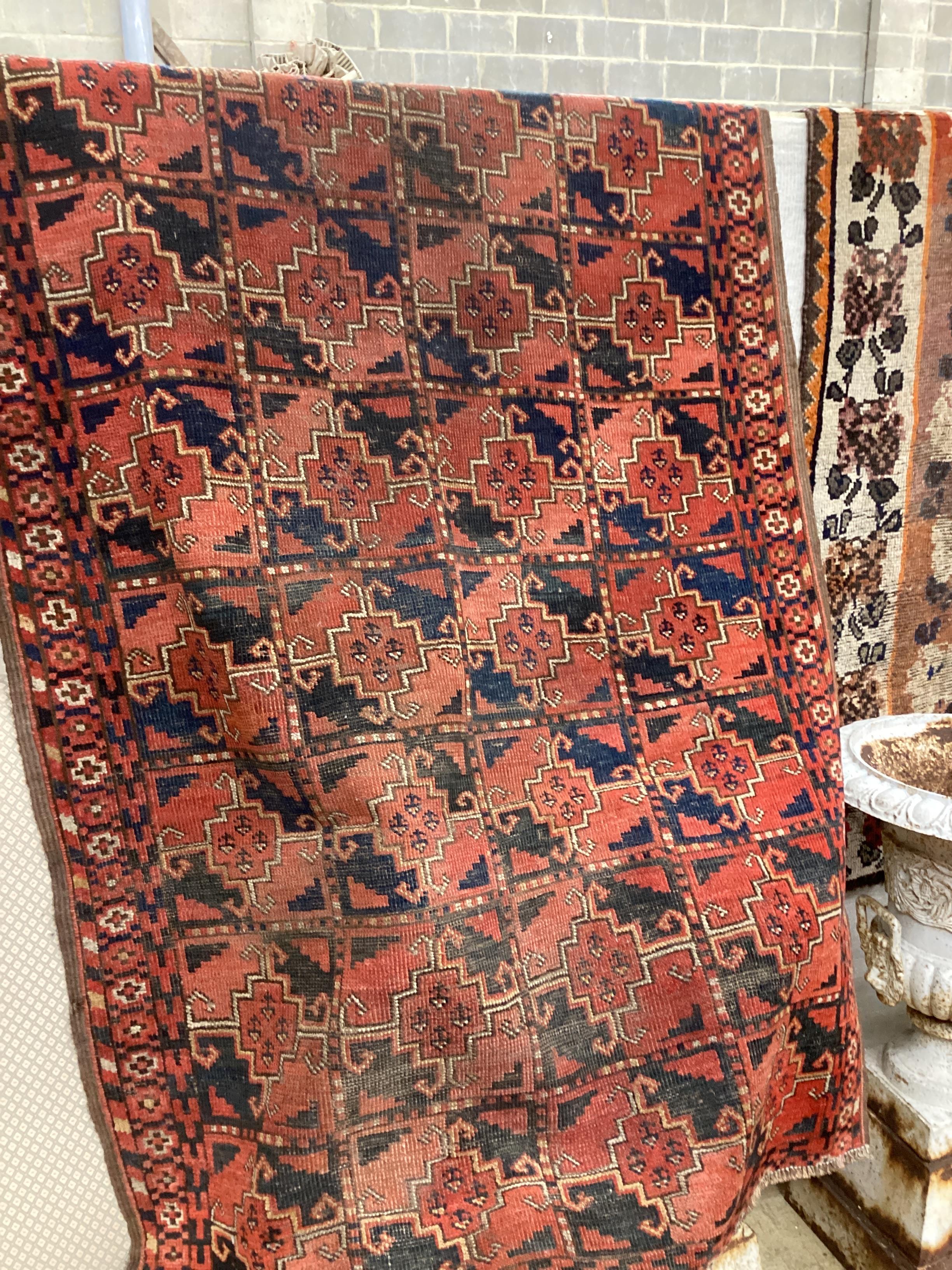 An antique Beshir Turkoman red ground rug 200cm x 109cm.